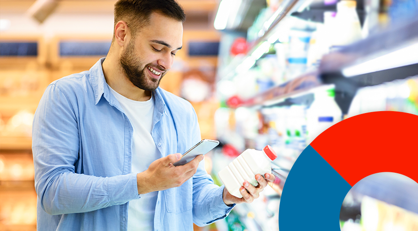 A man holding a mobile phone in one hand and a grocery item bottle in another had. The image reflect 'A Phygital custoimer experience'